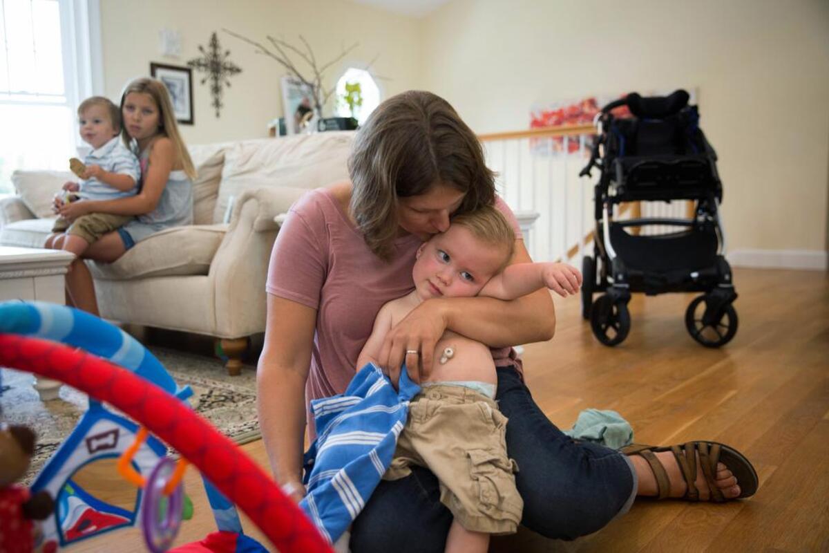Erica Mumm with her 15-month-old, Christian. His severe epilepsy appears to be relieved by the drug Potiga, which GlaxoSmithKline has pulled from the market because it is used by so few patients.