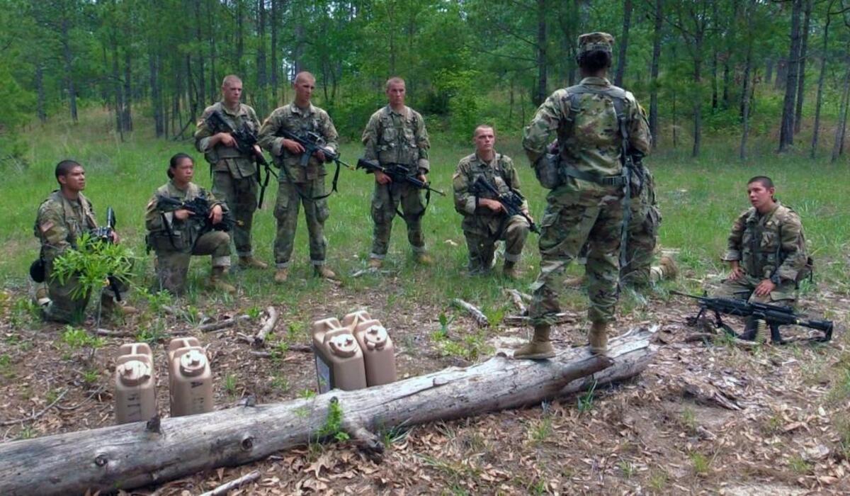 Sgt. 1st Class Karen Carter, the senior drill sergeant for 1st Platoon, Alpha Company, 1st Battalion, 19th Infantry Regiment gives an after-action report to soldiers recently during a field training exercise during One Station Unit Training at Fort Benning, Georgia.The third and final phase of U.S. Army gender integration reached a significant milestone Friday when 18 women graduated from active duty basic training at Fort Benning, becoming infantrymen.
