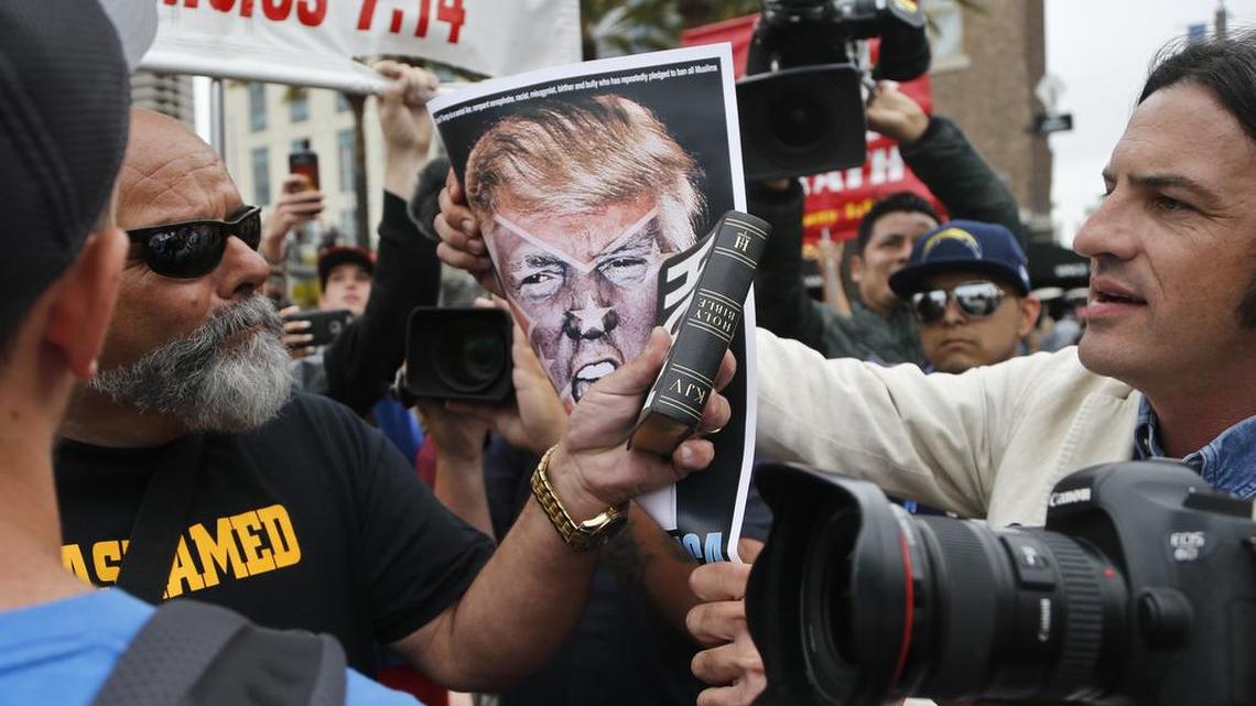 A pro-Trump speaker, left, is confronted by an anti-Trump demonstrators outside the San Diego Convention Center where Republican presidential candidate Donald Trump was scheduled to speak, Friday, May 27, 2016, in San Diego. Much of the internet has widened the partisan divide – but research conducted at Harvard Business School shows that Wikipedia’s collaborative editing and strong community standards helps bridge the gap, even on contentious topics.