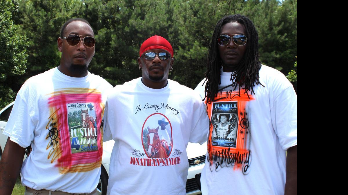 
Friends of Jonathan Sanders poses for a photo with at his funeral service wearing T-shirts that honored Sanders and his love of horses on Saturday, July 18, 2015, in Quitman, Miss. Sanders, who had been driving a horse and buggy died after a fight with a Stonewall police officer. 
