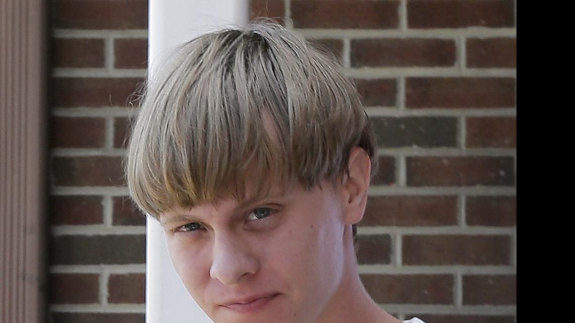 
Charleston, S.C., shooting suspect Dylann Storm Roof is escorted from the Sheby Police Department in Shelby, N.C., on June 18.
