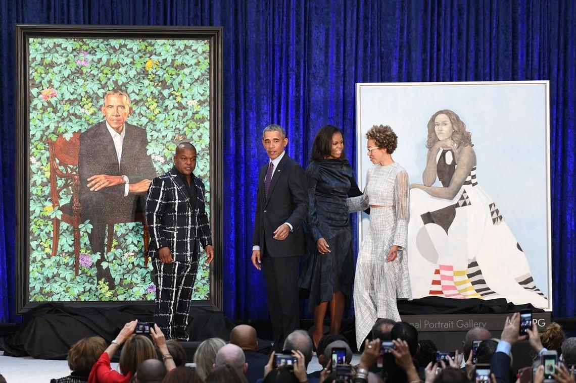 Former first lady Michelle Obama and former President Barack Obama pose with artists Kehinde Wiley and Amy Sherald during the unveiling of their official portraits at the National Portrait Gallery on February 12, 2018 in Washington, D.C.
