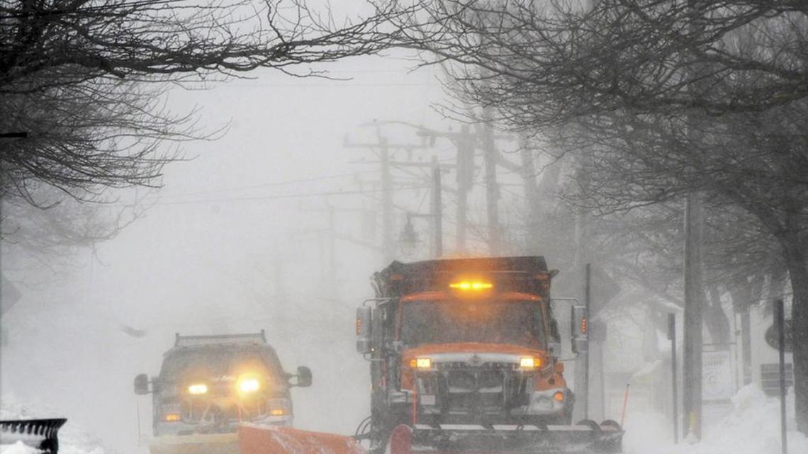 Plows move snow off Main street in Hyannis, Mass., Monday. A wind-driven winter storm brought blizzard conditions to Cape Cod and threatened to drop up to 18 inches of snow on southeastern Massachusetts on Monday.