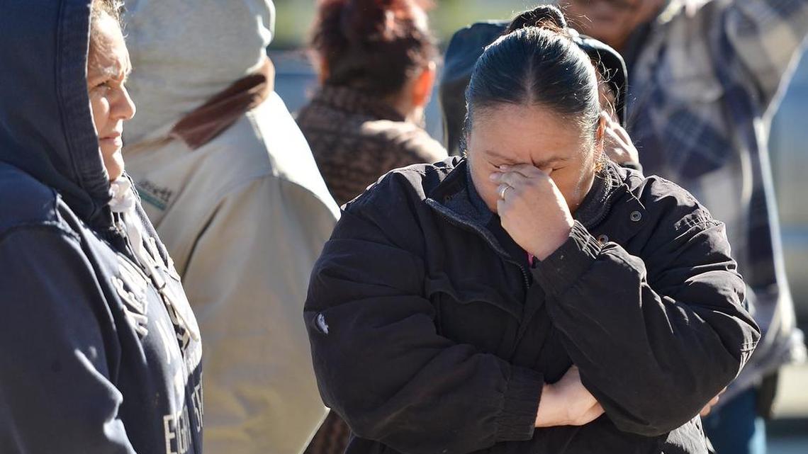 In a Bee file photo, Maria Lopez, right, and her cousin Reyna Camacho, wait in line at a community food bank event.