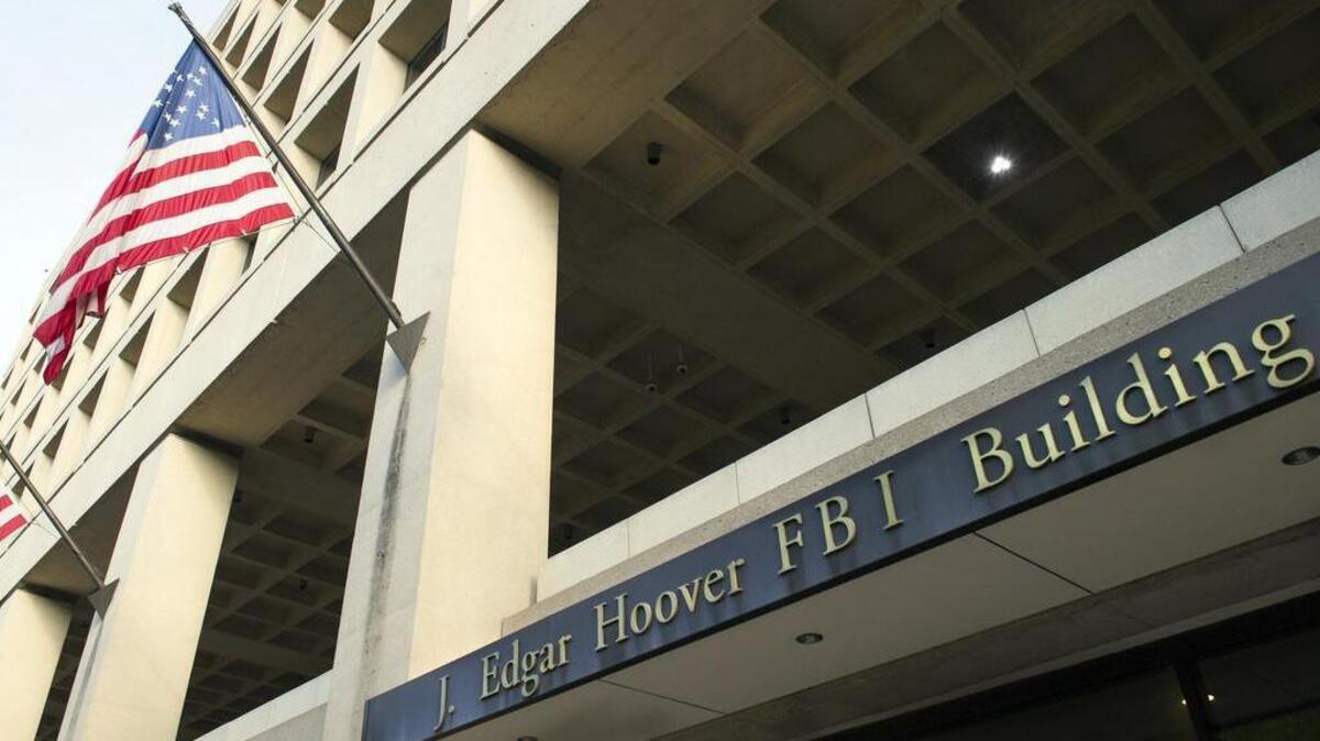 The J. Edgar Hoover FBI headquarters building is pictured in Washington, D.C. An FBI counterterrorism supervisor is under internal investigation after a woman stole his gun following a night of heavy drinking in a North Carolina hotel, reports show.
