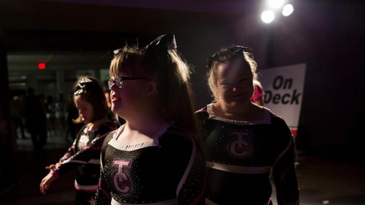 Brittany Lowe stands backstage with her team at the Dallas Convention Center waiting to compete in the NCA All-Star National Championship in the special athlete division. Lowe has been cheering on an all special needs team since age 5.