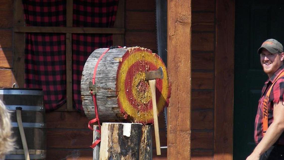 Axe-throwing events, such as this one in Alaska, have been traditionally outdoors. But now, indoor venues are offering the sport.