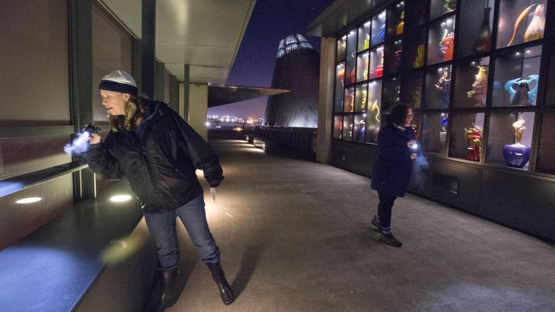 Hilltop neighbors Tobi Tommaney and Emily Coates, right, scour the bridge of glass for Monkeyshines treasures after heading out in downtown Tacoma at 4:30 a.m.