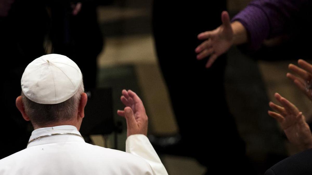 
People reach for Pope Francis as he enters the Basilica of the National Shrine of the Immaculate Conception to lead a canonization Mass in Washington, Wednesday, Sept 23, 2015. 
