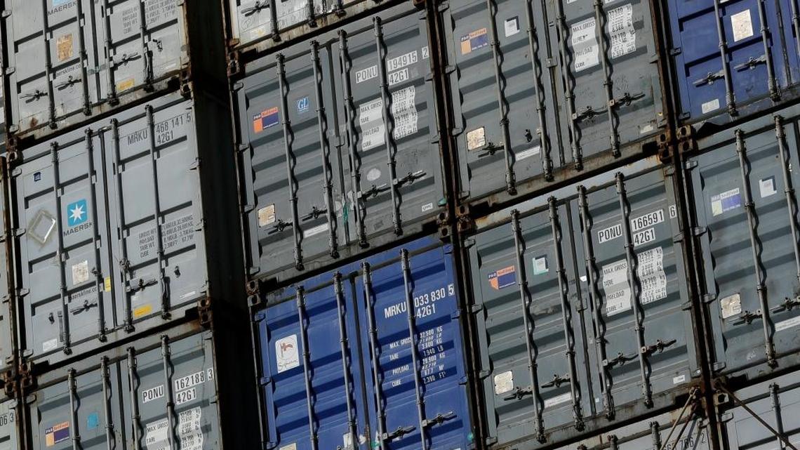 Containers wait to be unloaded from a ship at the Port of Baltimore in Baltimore. Shipping is one of the sectors that could be disrupted by the blockchain technology that underpins bitcoin.
