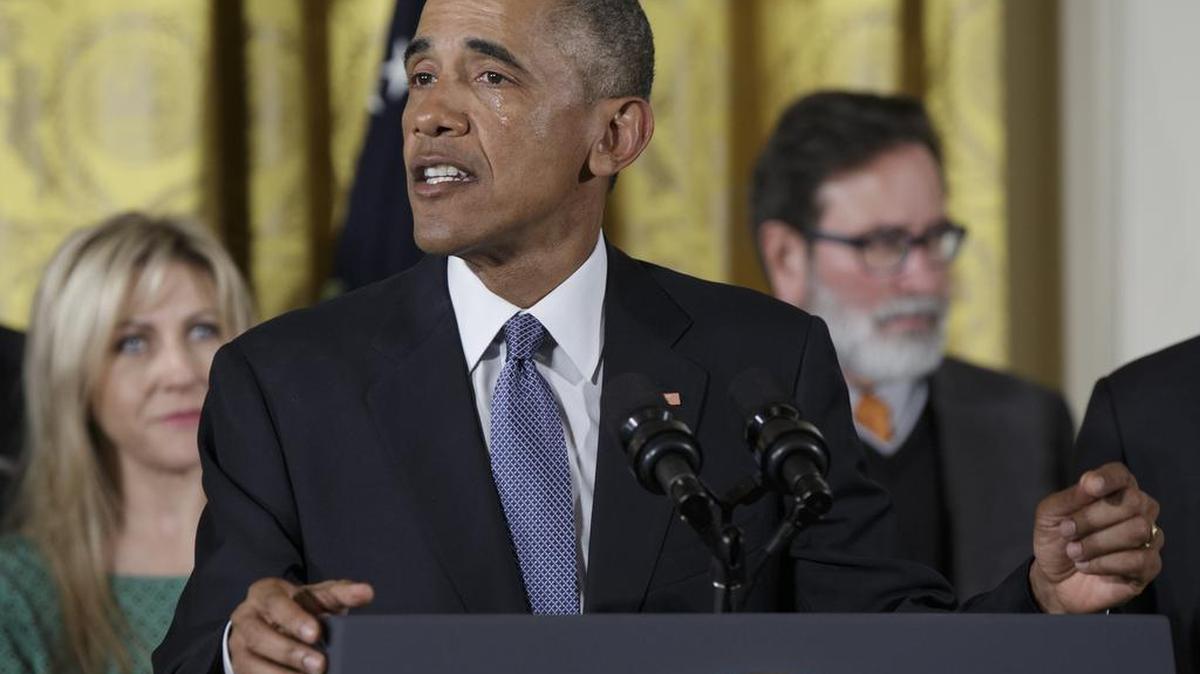 Tears flow down President Barack Obama's face as he speaks in the East Room of the White House in Washington, Tuesday, Jan. 5, 2016, about steps his administration is taking to reduce gun violence. Also on stage are stakeholders, and individuals whose lives have been impacted by the gun violence.