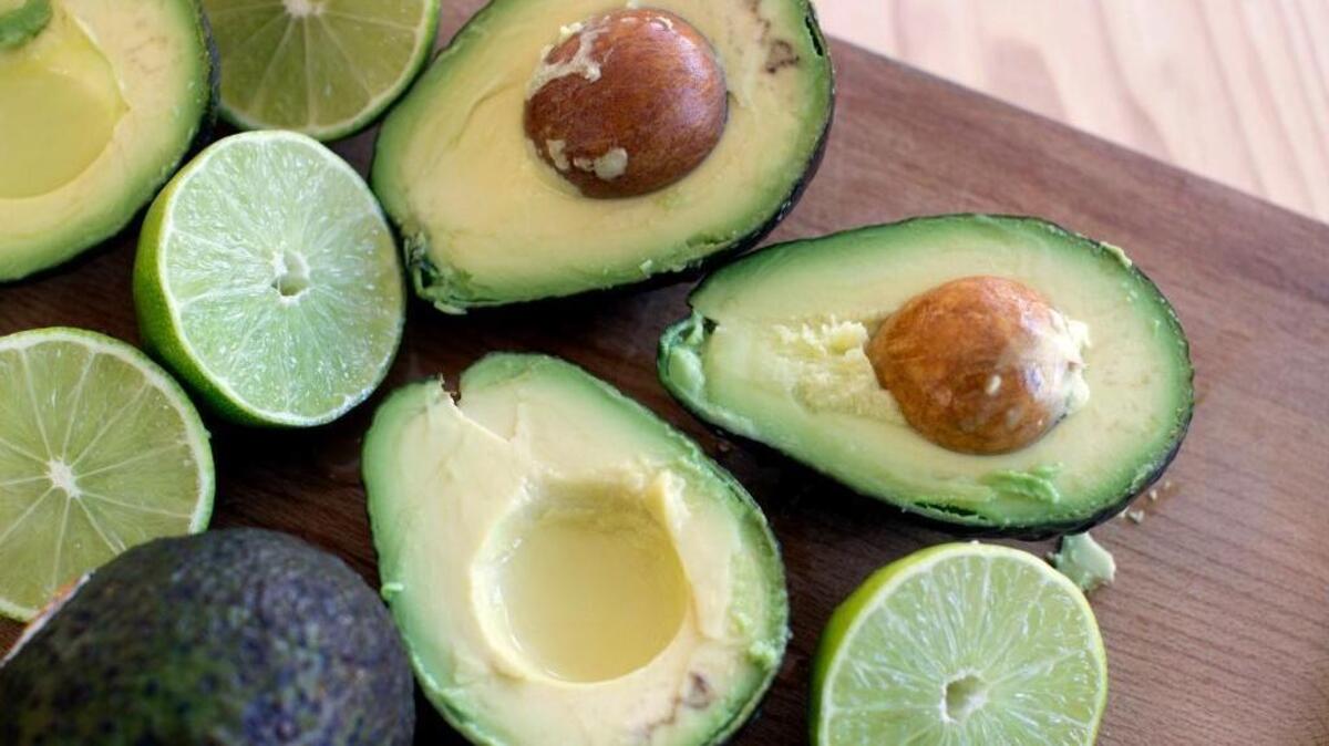 This Dec. 15, 2014, photo shows avocados and limes, key ingredients for guacamole, in Concord, N.H. 