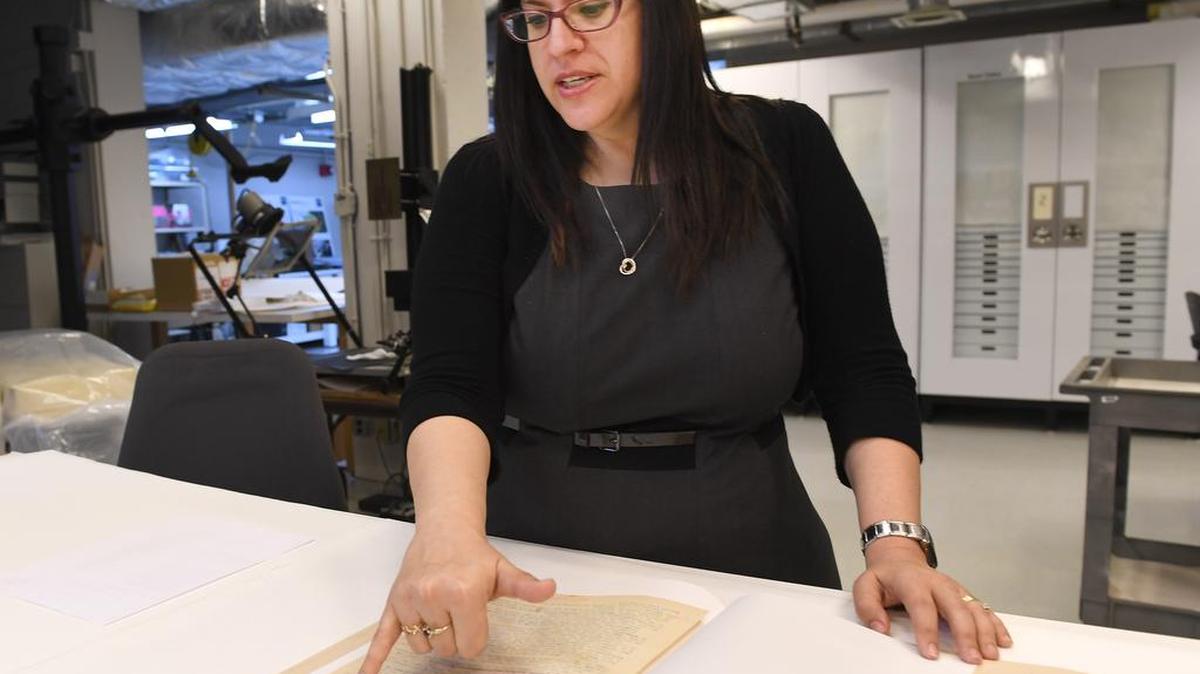 Curator Kyra Schuster, U.S. Holocaust Museum curator, shows a manuscript of Primo Levi’s famous holocaust memoir, “Survival in Auschwitz,” which has just been donated to the holocaust museum in Washington, D.C. “This was really one of the first published memoirs of a survivor’s experience that really talked about the camps,” Schuster said of the manuscript.