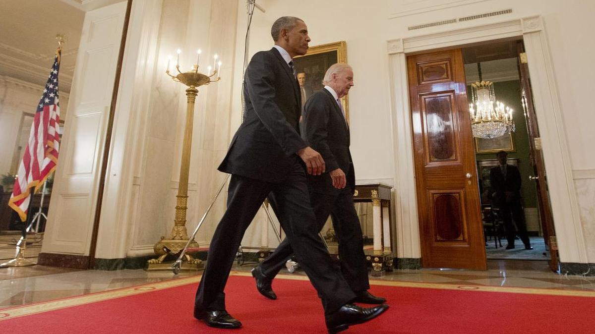 
President Barack Obama walks with Vice President Joe Biden, after delivering remarks in the East Room of the White House in Washington, Tuesday, July 14, 2015, after an Iran nuclear deal is reached. 
