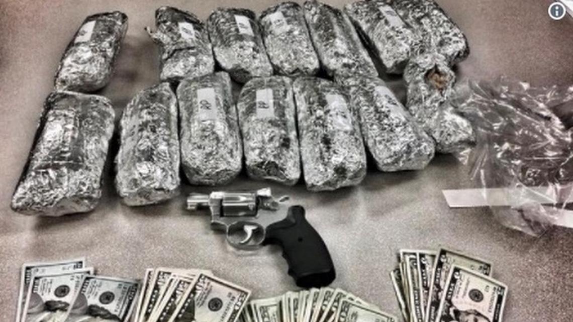 During a traffic stop, Los Angeles police discovered 14 foil-wrapped packages disguised to look like burritos, a loaded handgun and a large amount of money, the department said.