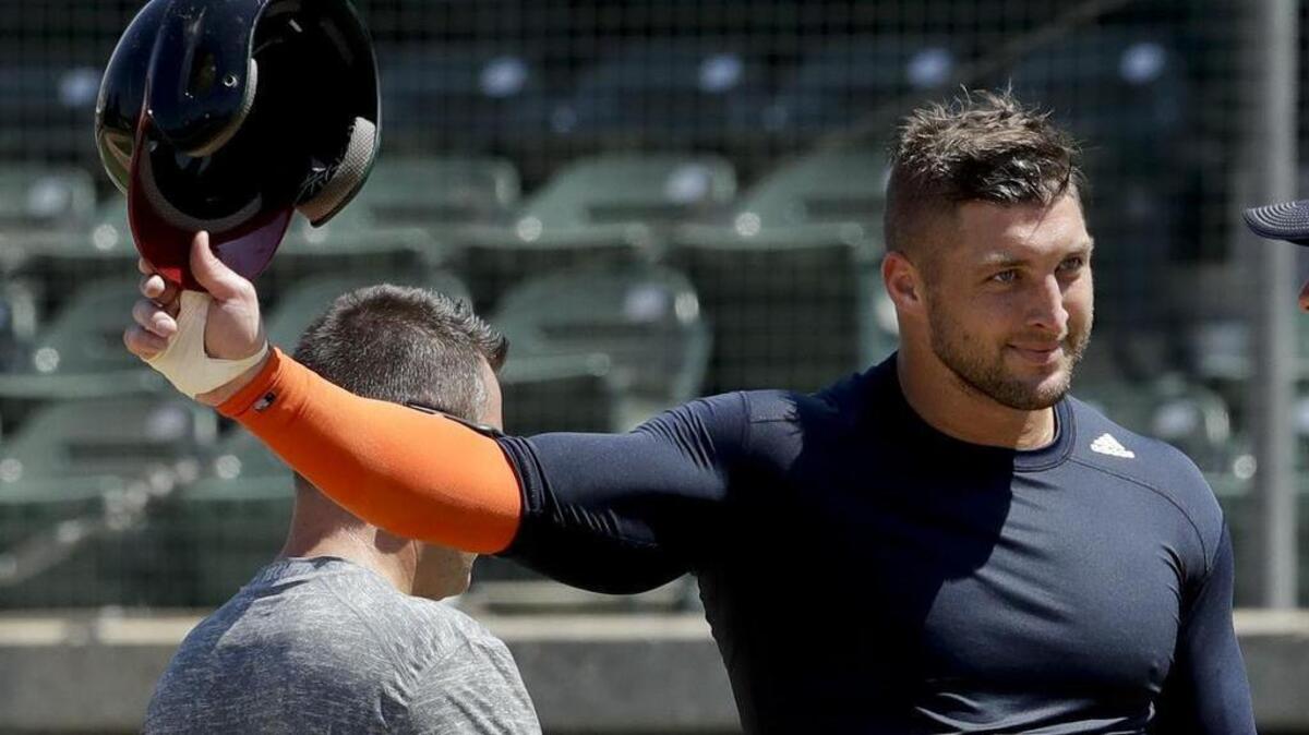 Former NFL quarterback Tim Tebow finishes his workout for baseball scouts and the media in Los Angeles on August 30, 2016. The New York Mets said Thursday, September 8, 2016, that Tebow signed a minor league contract and will take part in the Instructional League in Port St. Lucie, Florida.