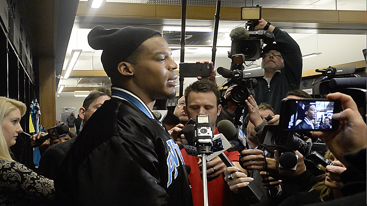 Cam talks to the media on Panther Check Out day at Bank of America stadium