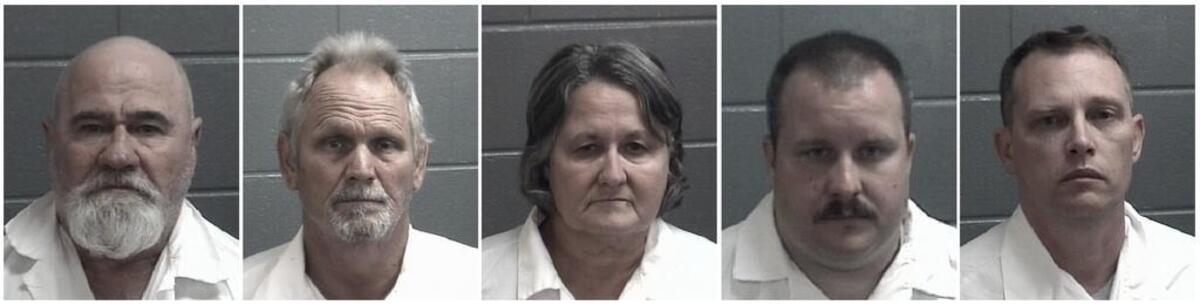 This combination of undated booking photos released by the Spalding County, Georgia, Sheriff's Department shows, from left, Frankie Gebhardt, Bill Moore Sr., Sandra Bunn, Lamar Bunn and Gregory Huffman, all charged in connection with the death of Timothy Coggins, a black man killed in Georgia in 1983. In October 2017, authorities charged Gebhardt and Moore with murder in the slaying of Coggins. Sandra and Lamar Bunn and Huffman have been charged with obstruction in the case. A prosecutor in the case said Coggins was killed because he had been “socializing with a white female.”