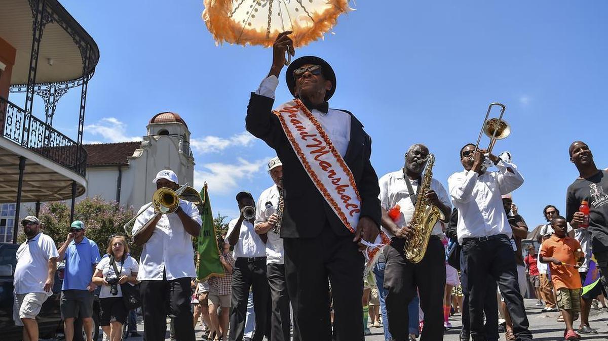 
Grand Marshall Oswald Jones, center, leads the Treme Brass Band during the “Satchmo Salute” Second Line Parade in the Treme neighborhood on Aug. 2, 2015, in New Orleans, La. 
