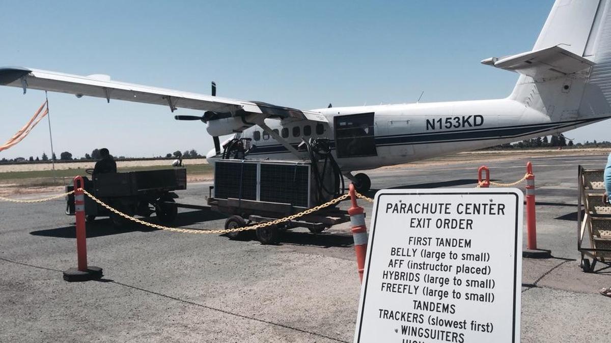 An Acampo-based Parachute Center plane rests on Saturday. Two men died in a skydiving accident Saturday morning near Lodi, authorities said.