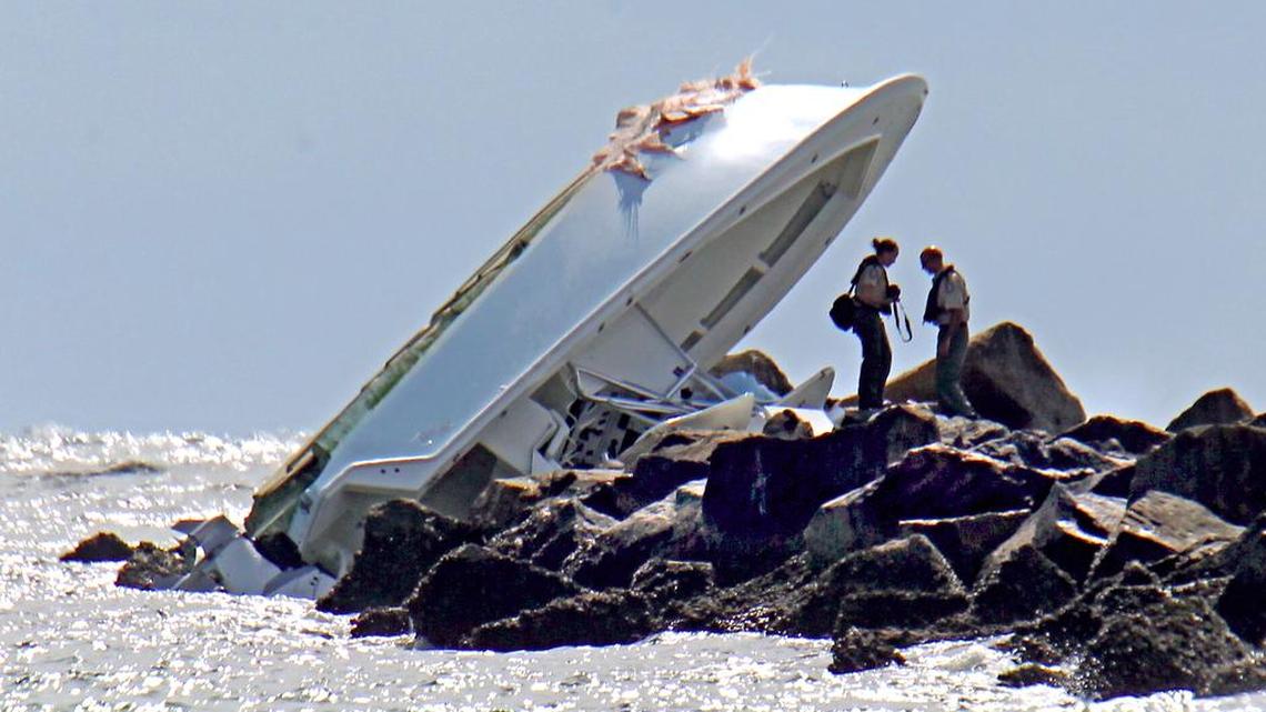 Investigators look at the boat that Marlins pitcher Jose Fernandez was aboard on Sunday, September 25, 2016.