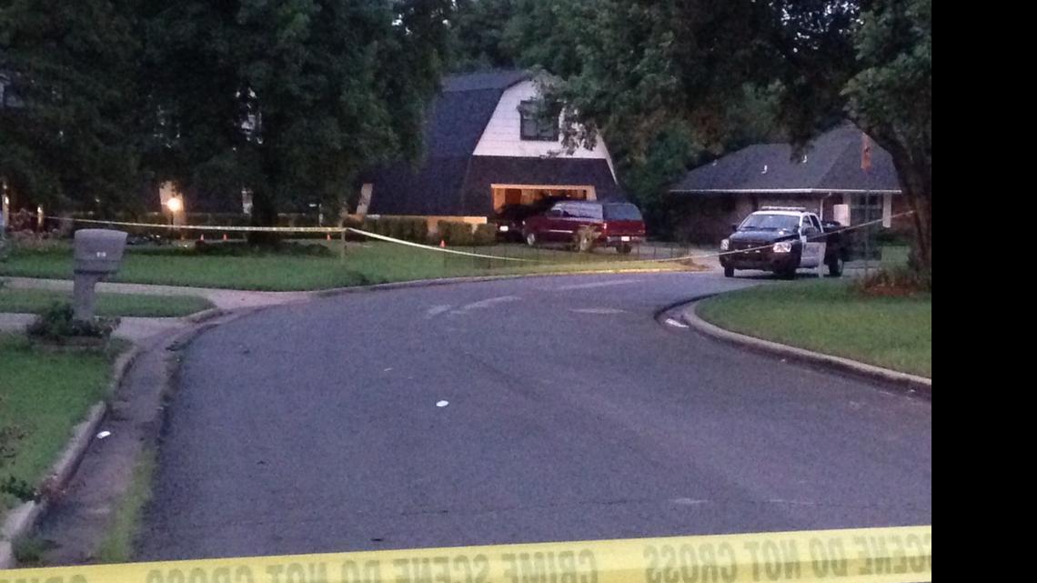 
Crime scene tape marks off the area as police investigate scene, Thursday morning, July 23, 2015, in Broken Arrow, Okla., where authorities say five people were found dead late Wednesday night. Police say a 16-year-old and an 18-year-old, who are both related to the victims, were taken into custody. 
