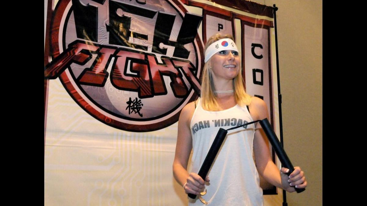 Milana Kuznetsova poses with nunchakus, also known asw nunchucks, Friday, Dec. 7, 2012.