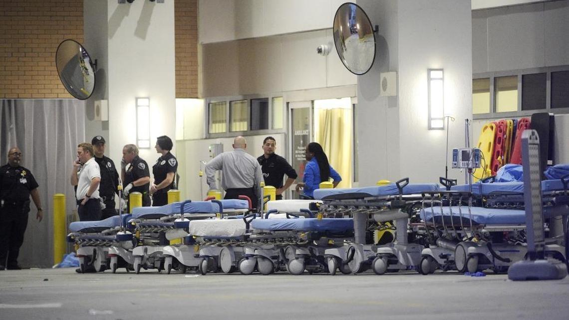 Emergency personnel wait with stretchers at the emergency entrance to Orlando Regional Medical Center hospital for the arrival of patients from the scene of a fatal shooting at Pulse Orlando nightclub in Orlando on Sunday, June 12, 2016.