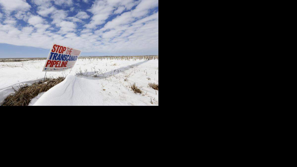 
 A sign reading “Stop the Transcanada Pipeline” sits in a field near Bradshaw, Neb., on March 11, 2013. Canadian company TransCanada went to court Tuesday to use eminent domain to force Nebraska landowners to give their property for the Keystone XL Pipeline, as the Senate moved closer to approving the controversial project.
