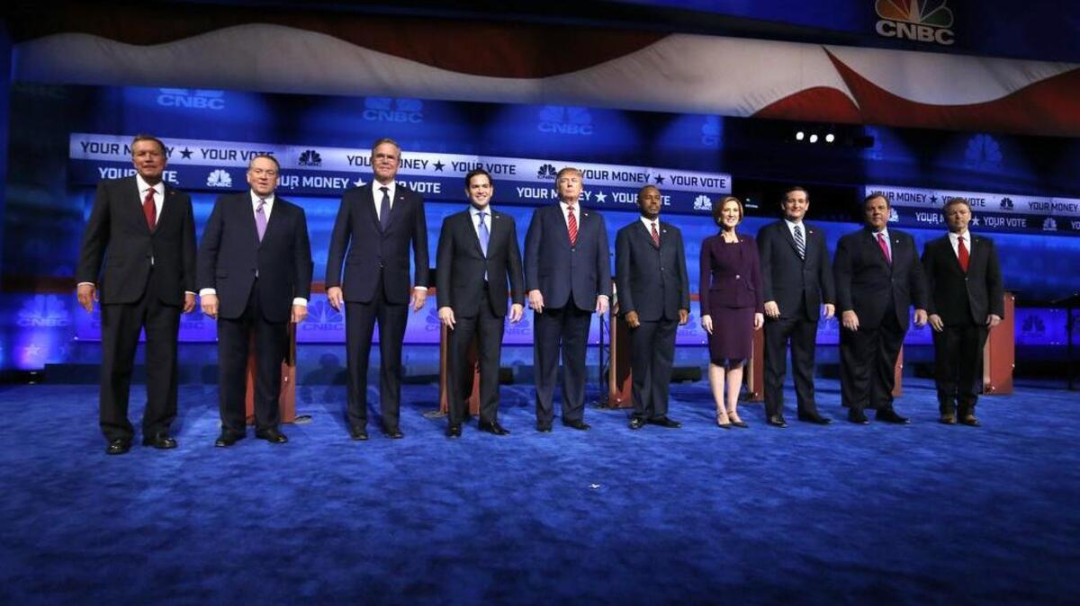 Republican presidential candidates, from left, John Kasich, Mike Huckabee, Jeb Bush, Marco Rubio, Donald Trump, Ben Carson, Carly Fiorina, Ted Cruz, Chris Christie, and Rand Paul take the stage during the CNBC Republican presidential debate at the University of Colorado, Wednesday, Oct. 28, 2015, in Boulder, Colo.