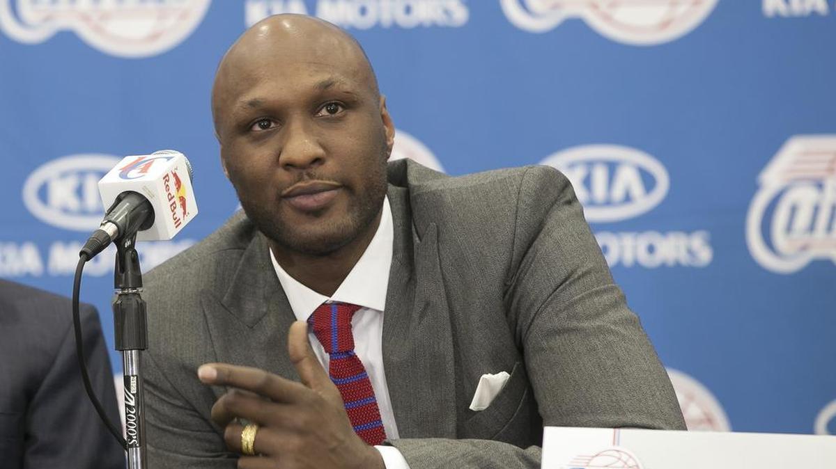 
In this July 2, 2012 file photo, newly acquired Los Angeles Clippers forward Lamar Odom takes questions during an NBA basketball news conference in Los Angeles. Odom, the former NBA star and reality TV personality embraced by teammates and fans alike for his humble approach to fame, was hospitalized and his estranged wife Khloe Kardashian is by his side, after being found unresponsive in a Nevada brothel where he had been staying for days. 
