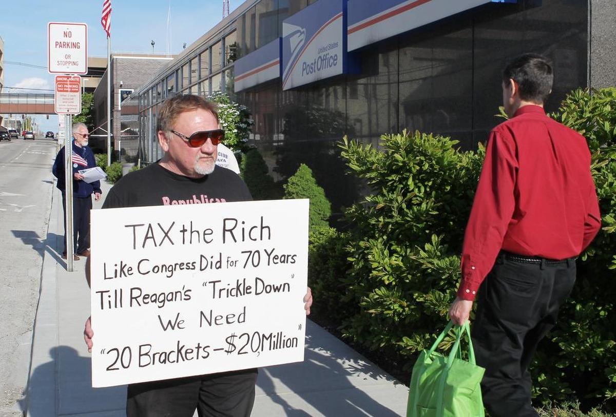 James Hodgkinson of Belleville was photographed protesting outside of the United States Post Office in Downtown Belleville.