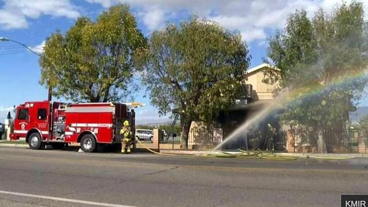 In this image made from video provided by KMIR-TC, firefighters battle flames at the Islamic Center of Palm Springs, a mosque in Coachella, Calif., just east of Palm Springs, Dec. 11, 2015. The fire was contained to the small building's front lobby, and no one was injured.