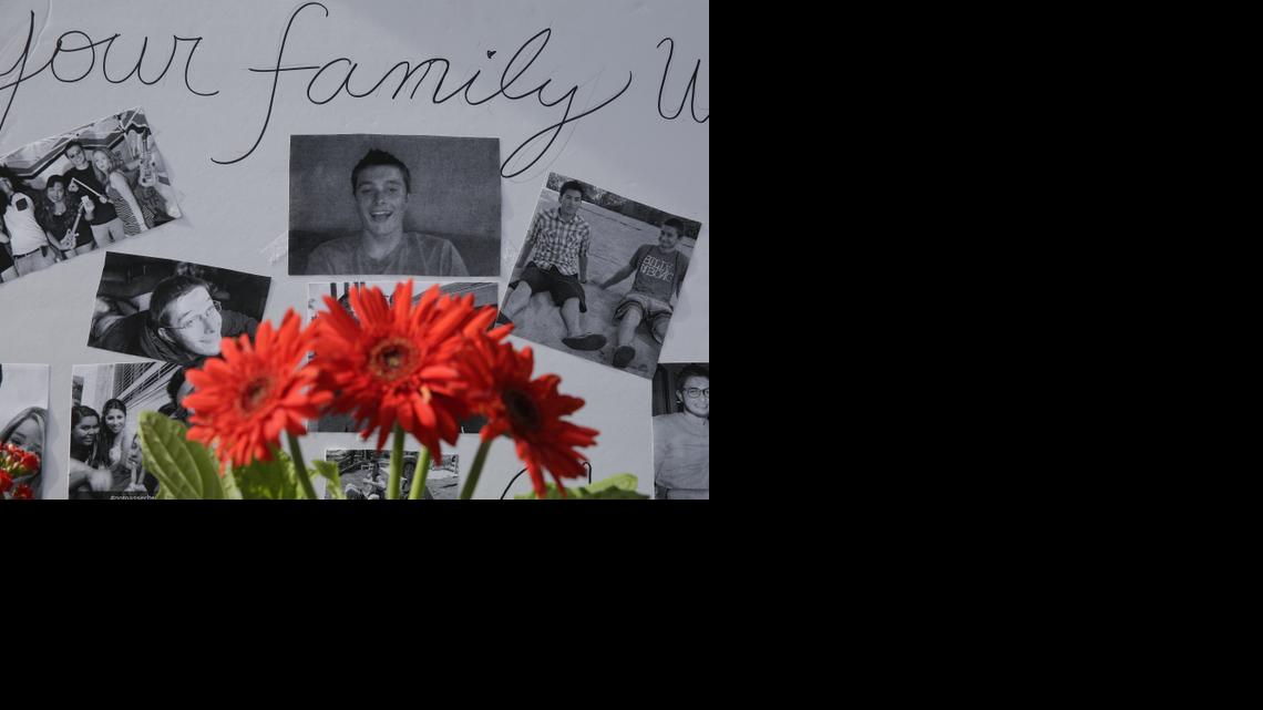 
Photographs of Christopher Martinez are displayed as part of a memorial in front of a IV Deli Mart, where part of a mass shooting took place by Elliot Rodger in Isla Vista in 2014.
