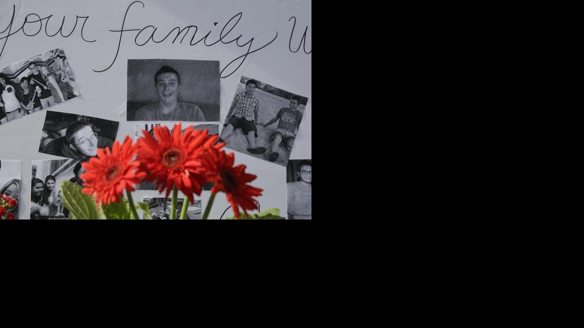 
Photographs of Christopher Martinez are displayed as part of a memorial in front of a IV Deli Mart, where part of a mass shooting took place by Elliot Rodger in Isla Vista in 2014.

