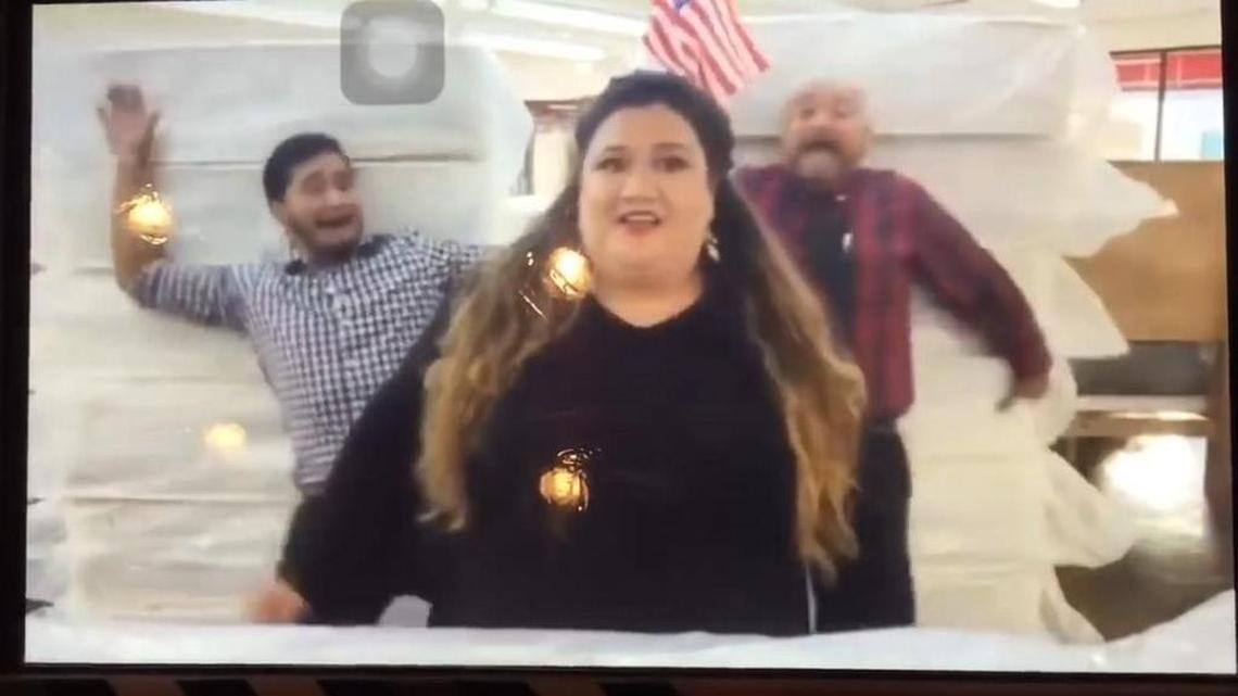 The advertisement for Miracle Mattress showed two employees falling into towers of twin mattresses.