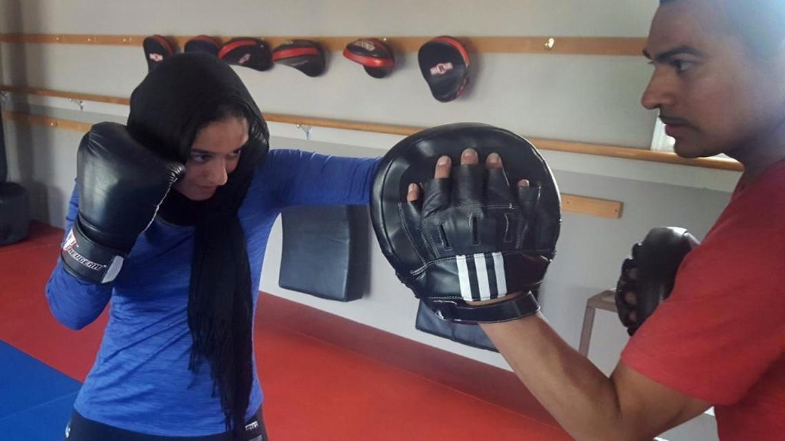 Uzma Shariff trains with her coach at a gym in Chicago. Shariff, a Muslim practitioner of jiujitsu and other martial arts, has received several requests for self-defense classes from fellow Muslim women who are concerned about anti-Muslim hostility in the wake of the election.