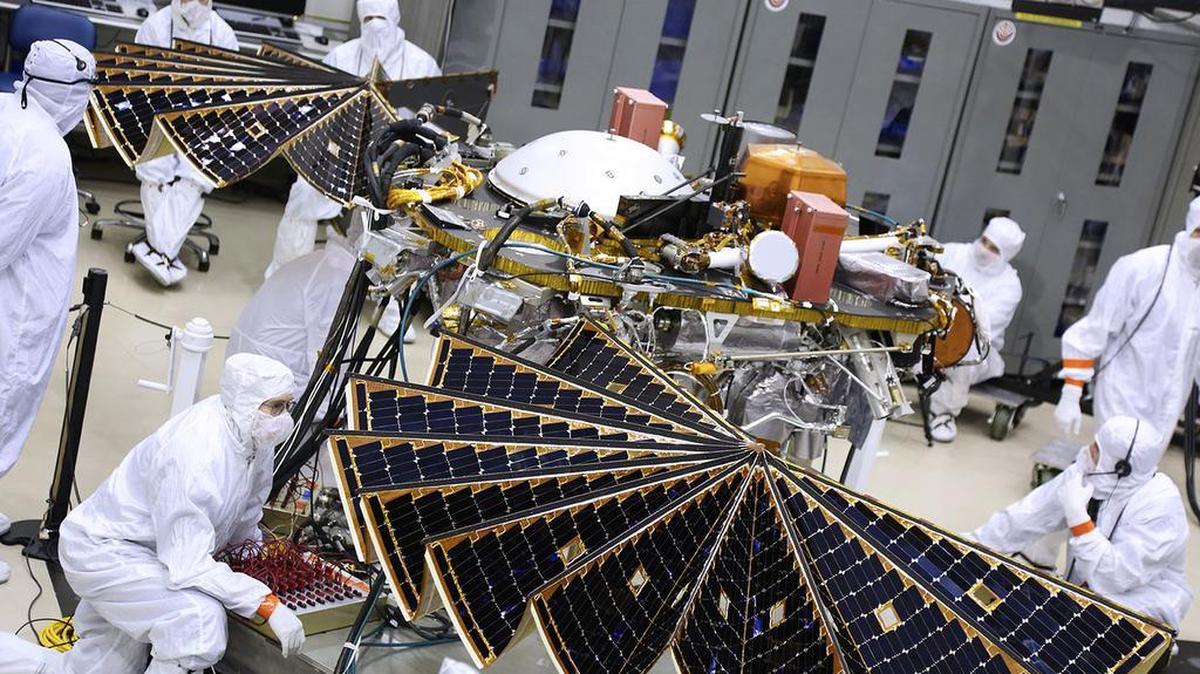 Engineers and technicians evaluate the solar arrays for the InSight Mars Landing. For future manned missions to Mars, microbes could help break down human waste while also producing edible biomass to feed astronauts, Penn State researchers say.