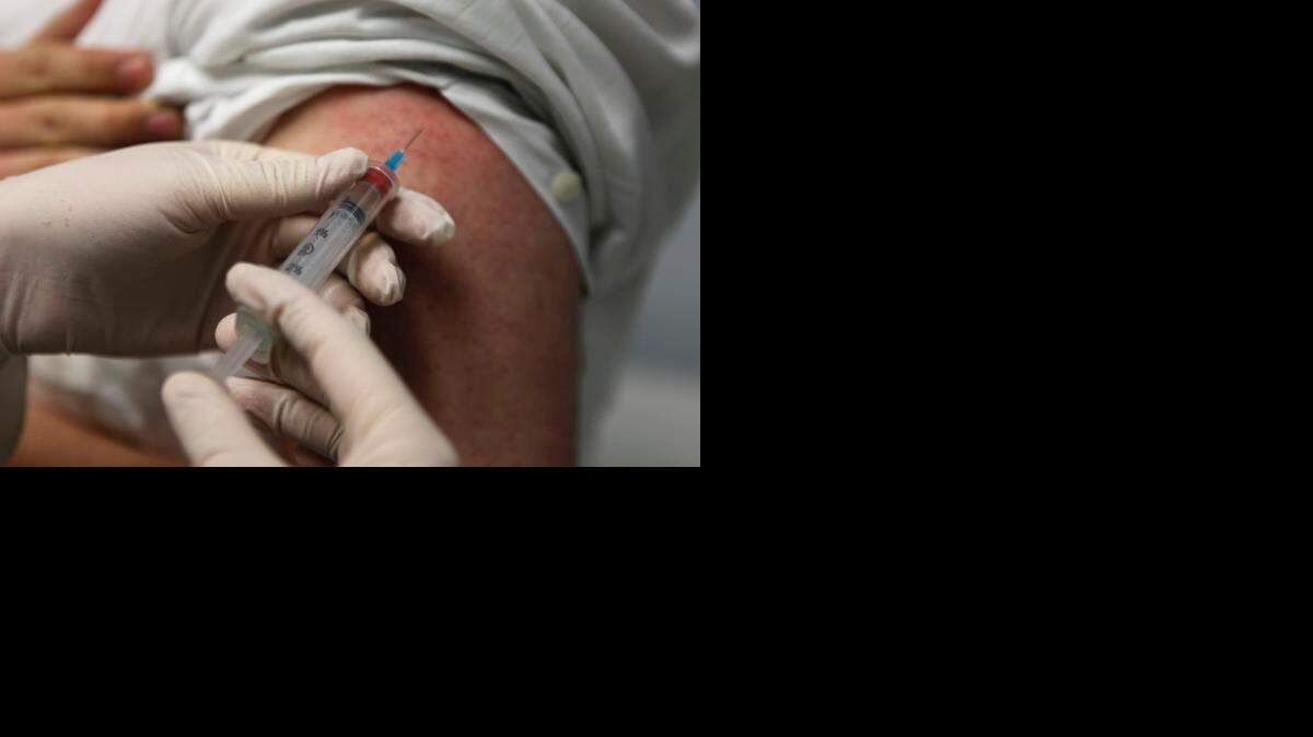
 Joel Friedman gets an MMR (measles- mumps-rubella) vaccination from Dov Landra, a physician assistant, at the Quality Health Center in New York, Feb. 23, 2010. 

