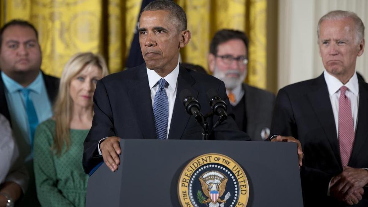 President Barack Obama, joined by Vice President Joe Biden, right, speaks in the East Room of the White House in Washington, Tuesday, Jan. 5, 2016, about steps his administration is taking to reduce gun violence.