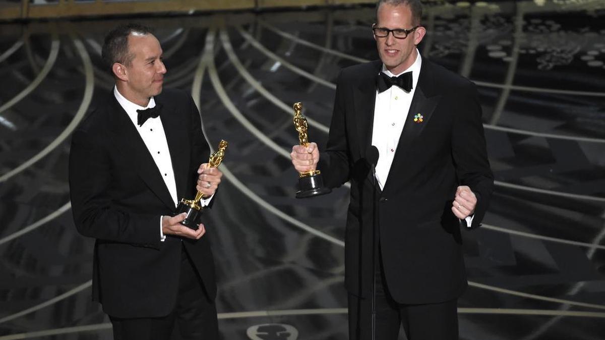 Jonas Rivera, left, and Pete Docter accept the award for best animated feature film for “Inside Out" at the Oscars on Sunday, Feb. 28, 2016, at the Dolby Theatre in Los Angeles. (Photo by Chris Pizzello/Invision/AP)