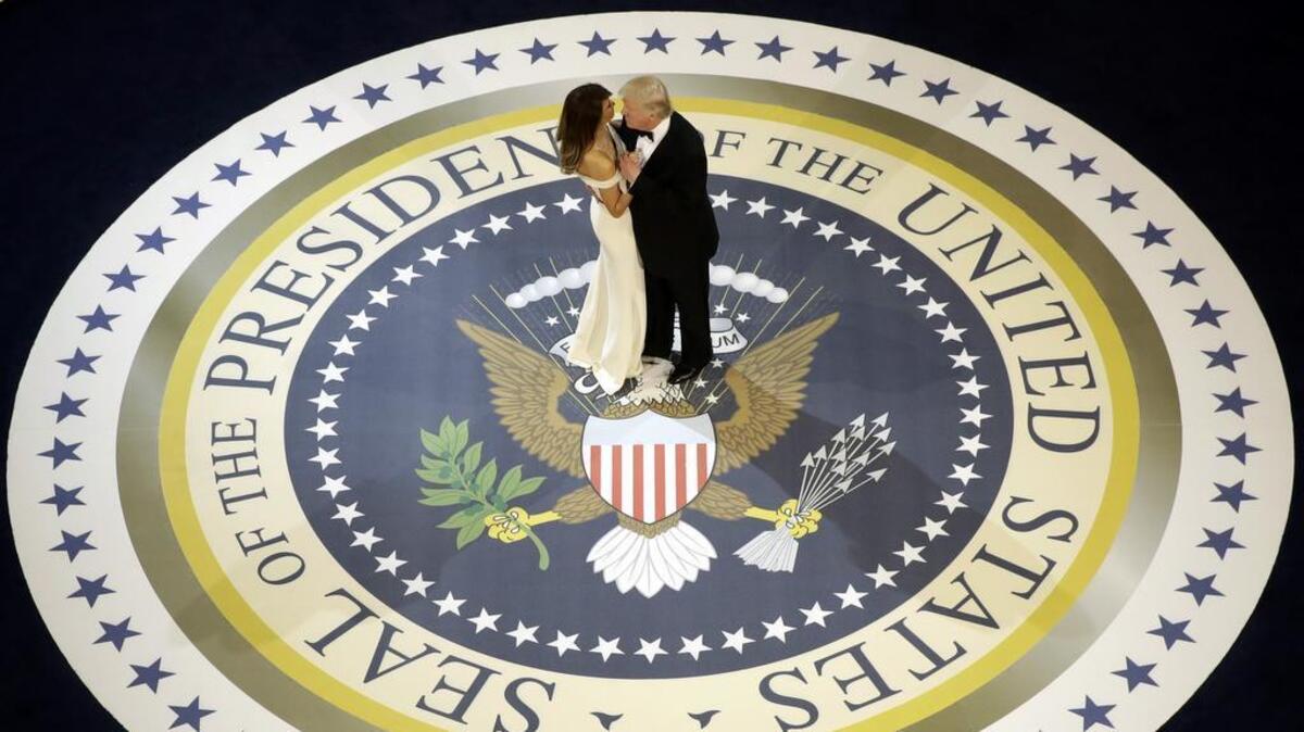 President Donald Trump dances with first lady Melania Trump, at The Salute To Our Armed Services Inaugural Ball in Washington, Friday, Jan. 20, 2017.