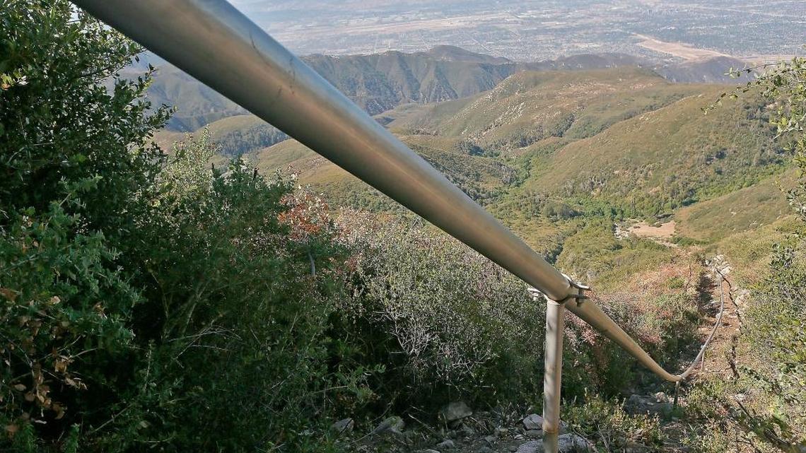 In this July 13, 2015, file photo, a pipeline carries water drawn from wells in the San Bernardino National Forest, Calif.