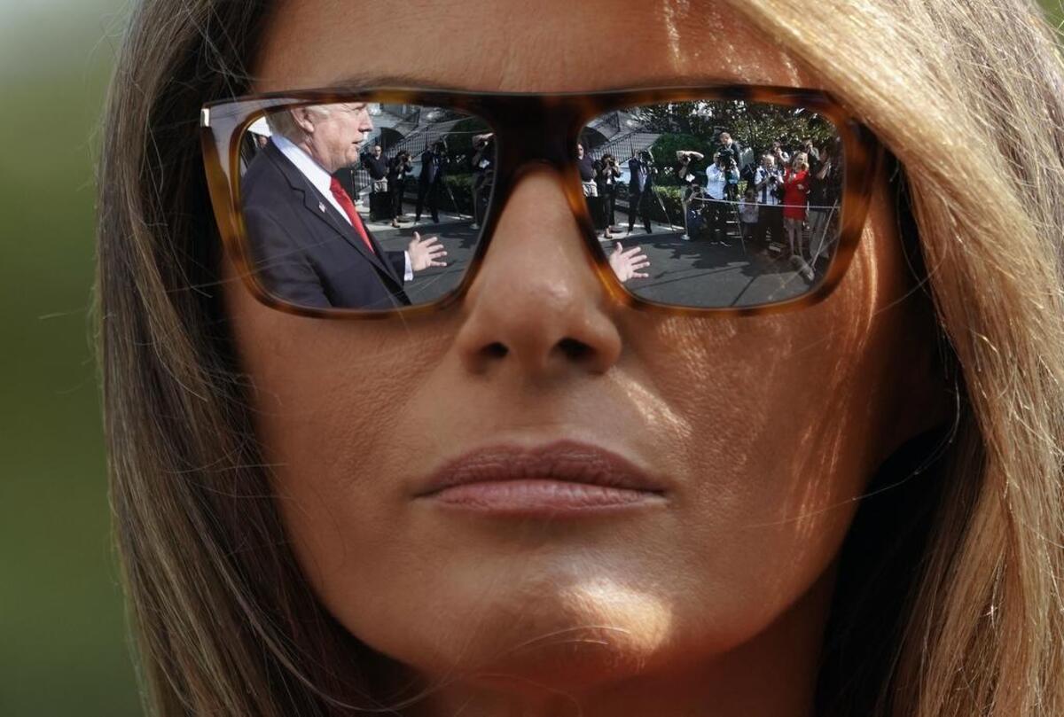 President Donald Trump and first lady Melania Trump walk across the South Lawn of the White House in Washington during their arrival on Marine One helicopter, Sunday, Sept. 10, 2017.