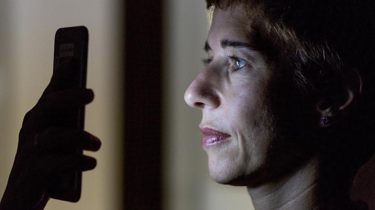 Secil Watson, the head of wholesale internet solutions at Wells Fargo, uses an eye scanner in the company’s app to gain access to her Wells Fargo account at her office in San Francisco this month.