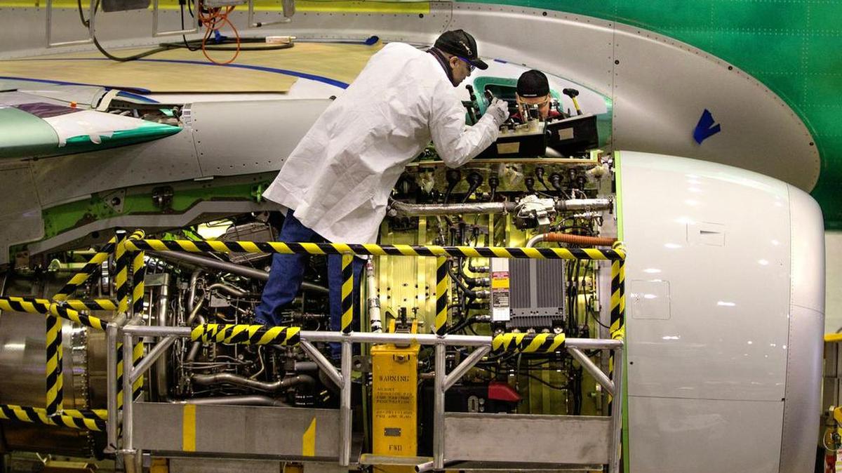The engine of a Boeing 737 is attached to the fuselage in one of two assembly lines at Boeing’s 737 assembly plant in Renton, Wash., on March 3, 2015.