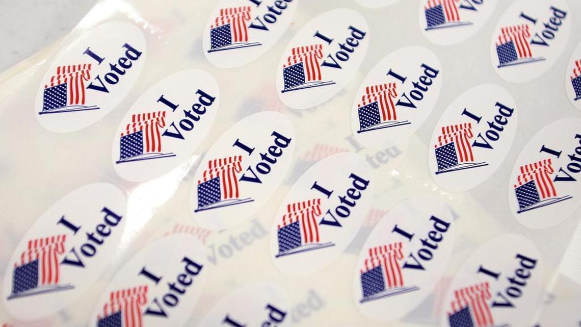 "I Voted" stickers sit on the registration table at the Canyon Lake Senior Center polling place in Rapid City, S.D.