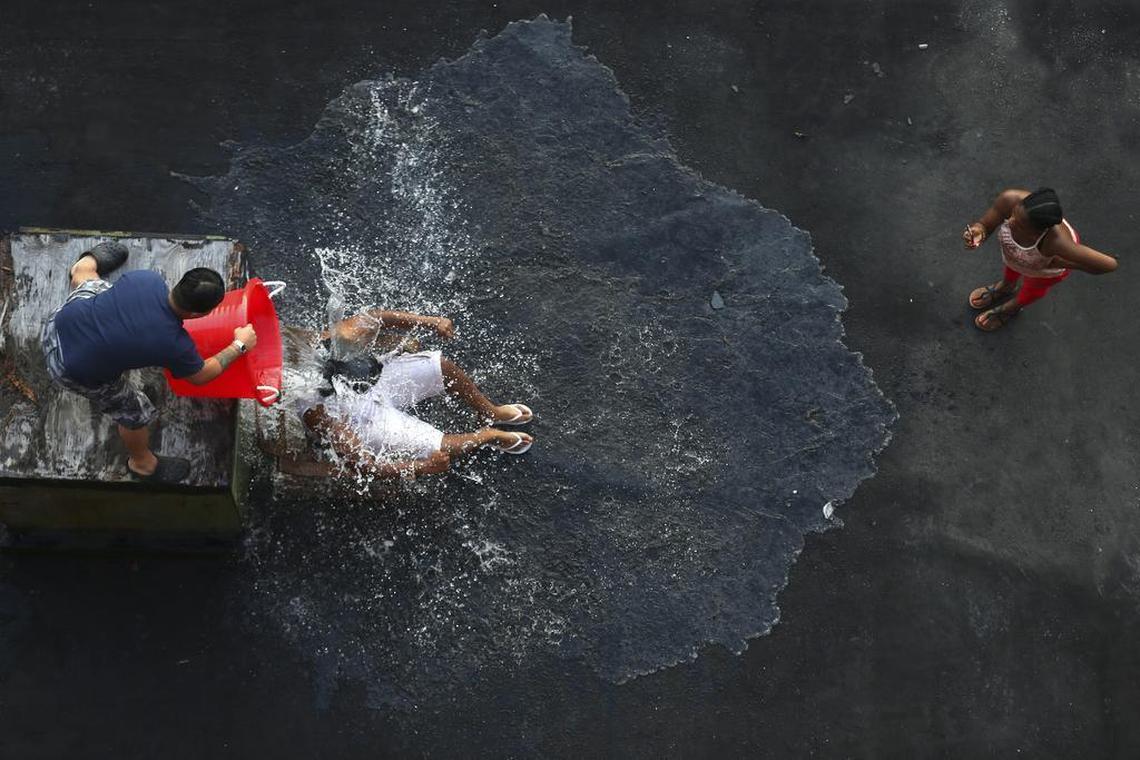 An Ice Bucket Challenge video is recorded in New York, Aug. 20, 2014. A social media campaign for research into amyotrophic lateral sclerosis that was disparaged by some as “slacktivism” raised $115 million and helped scientists discover a new gene tied to ALS.