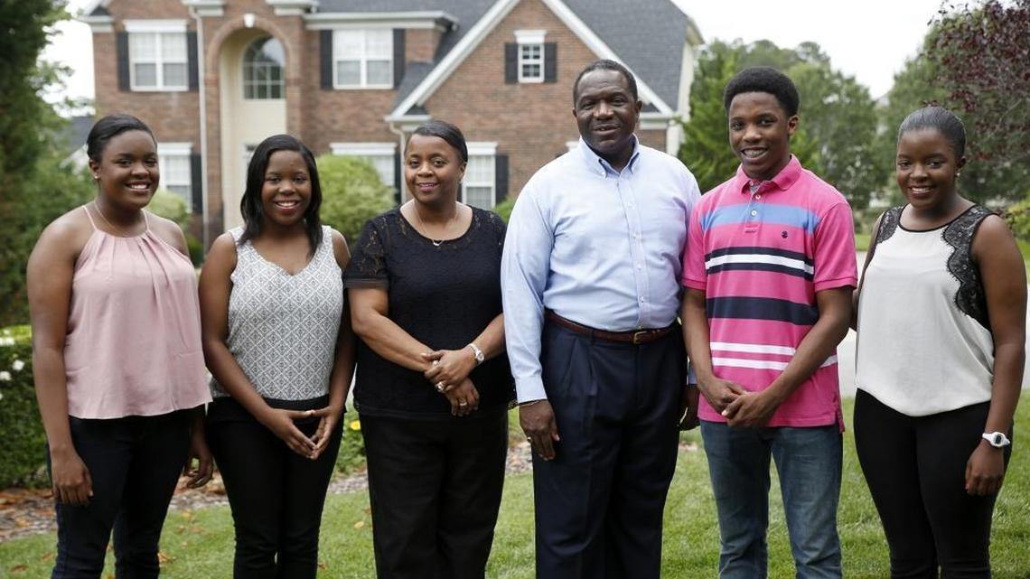 The Mitchell quadruplets – Kennedy, Katelyn, Grayson and Kelsey – stand with their parents outside the family’s house in Charlotte. All four of the quadruplets have been recognized for their academic achievements.