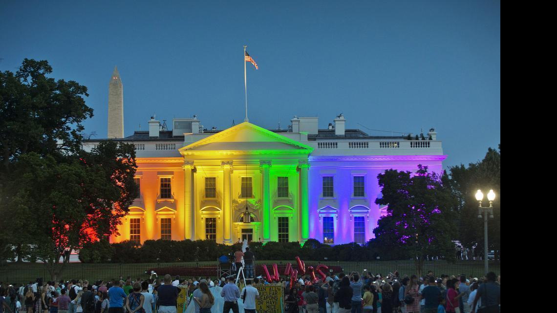 
People gathered in Lafayette Park to see the White House illuminated on Friday, June 26, 2015, with rainbow colors in commemoration of the Supreme Court's ruling to legalize same-sex marriage.
